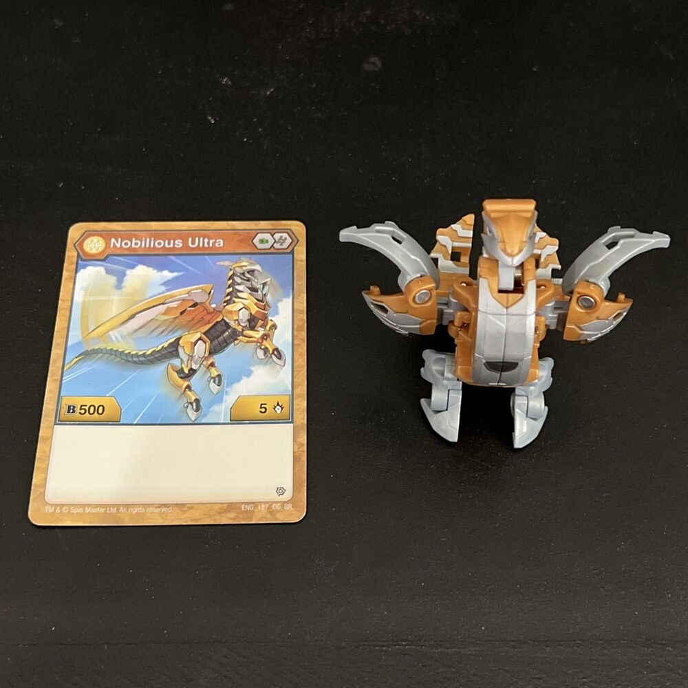 Bakugan Battle Planet Aurelus Nobilious Ultra B500 Gold w/ Character Card